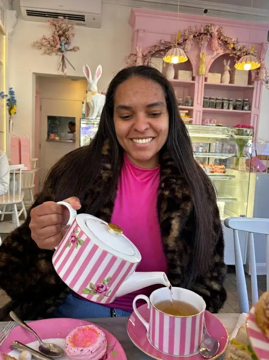 Deb pouring tea